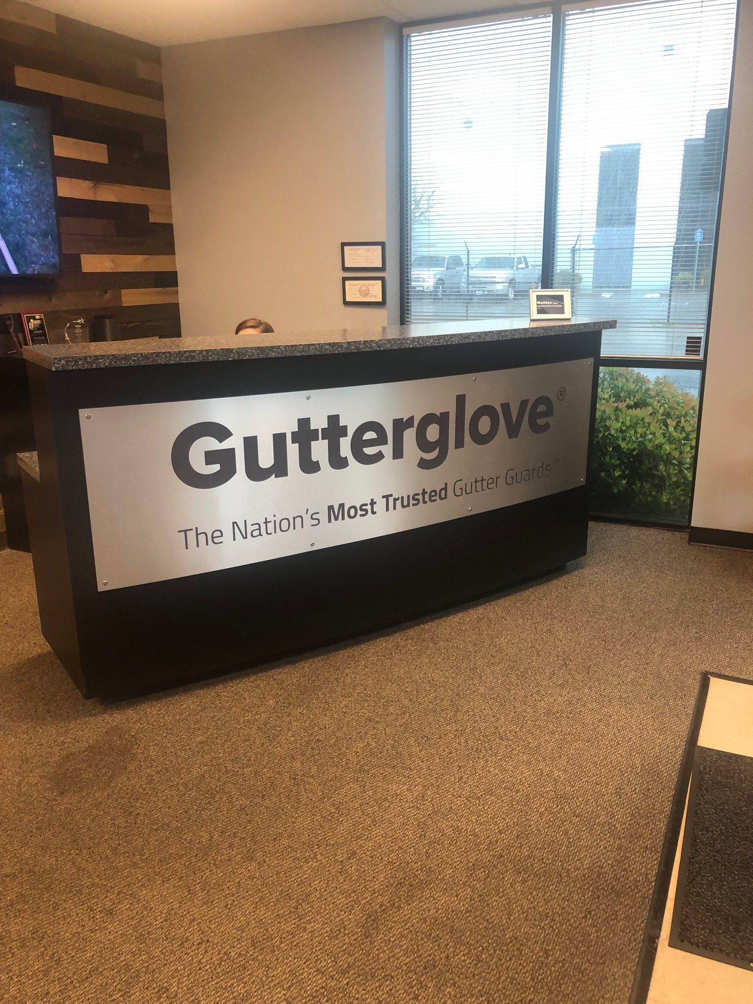 Gutterglove front desk sign