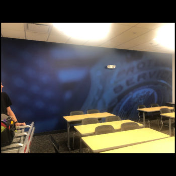 police badge wall mural on blue background