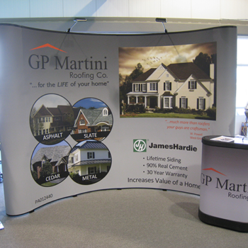 A tradeshow display and podium stand for a roofing company.