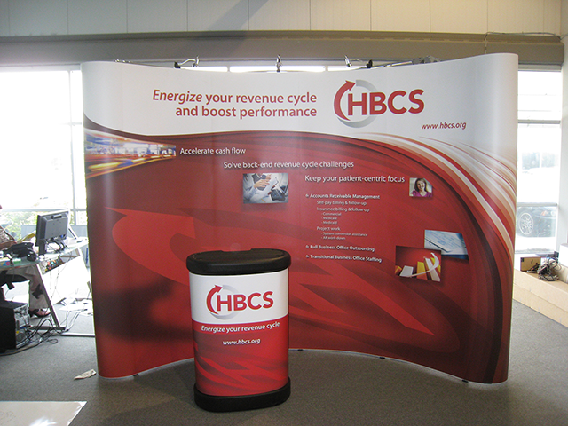 A tradeshow display and podium stand for HBCS.