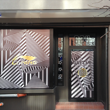 A store front with custom window graphics.