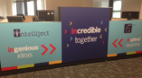 Wall graphics along cubical dividers in a business.