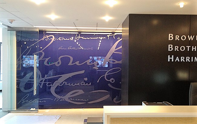 A large custom window graphic in the lobby of an office building.