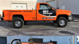 A fleet of vehicles with custom designed vehicle wraps for Hay Sealcoating LLC.