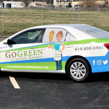 A car with a custom vehicle wrap made for Go Green Cleaning Experts by SpeedPro of West Chester.
