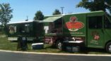 Two food trucks with custom designed vehicle graphics by SpeedPro West Chester.