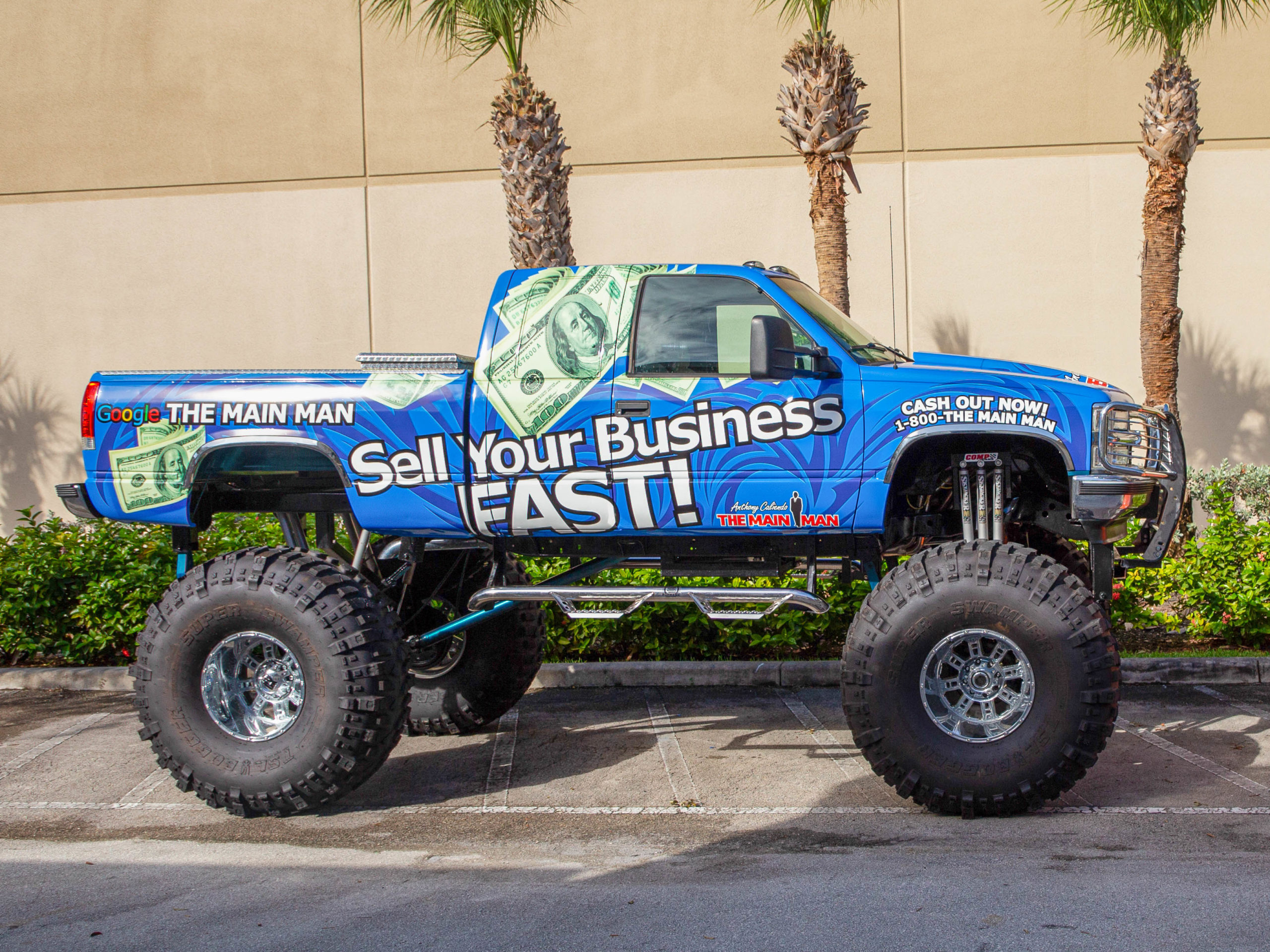 A monster truck vehicle wrap for The Main Man company