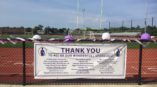 Thank sponsors banner at sports stadium