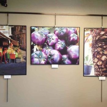three framed art gallery images