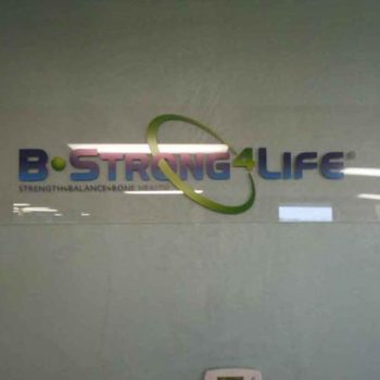 glass sign with decal sticker of Bstrong logo