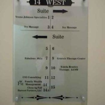 Building directions on glass wall sign