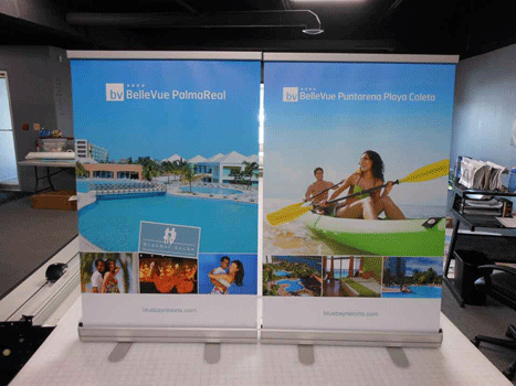 Two standing poster signs displaying graphics for BelleVue.
