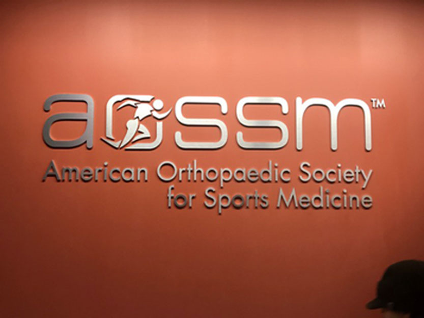 Closer image of AOSSM wall logo reception signage