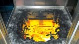 3D floor graphic creating an illusion of a fiery explosion inside an elevator shaft.