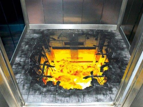 3D floor graphic creating an illusion of a fiery explosion inside an elevator shaft.