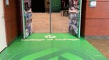 Welcome to the Community Leadership Breakfast graphic with College of DuPage branding and green floor graphics.