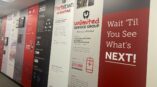Environmental graphics wall display featuring timeline of Parts Town Unlimited with bold branding and text elements.