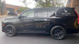 Partial vehicle wrap for Grey Goose vodka displayed on a black SUV with a sleek design and matte finish.