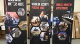 Retractable banner displays for GPX emphasizing industry applications and security with engaging visuals.