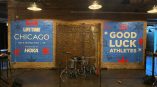 Wall mural for Life Time Chicago Half Marathon and 5K featuring motivational graphics in blue and red.
