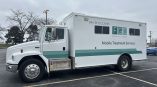 Full truck wrap for Family Guidance Centers featuring the logo and “Mobile Treatment Services” in green and white design.