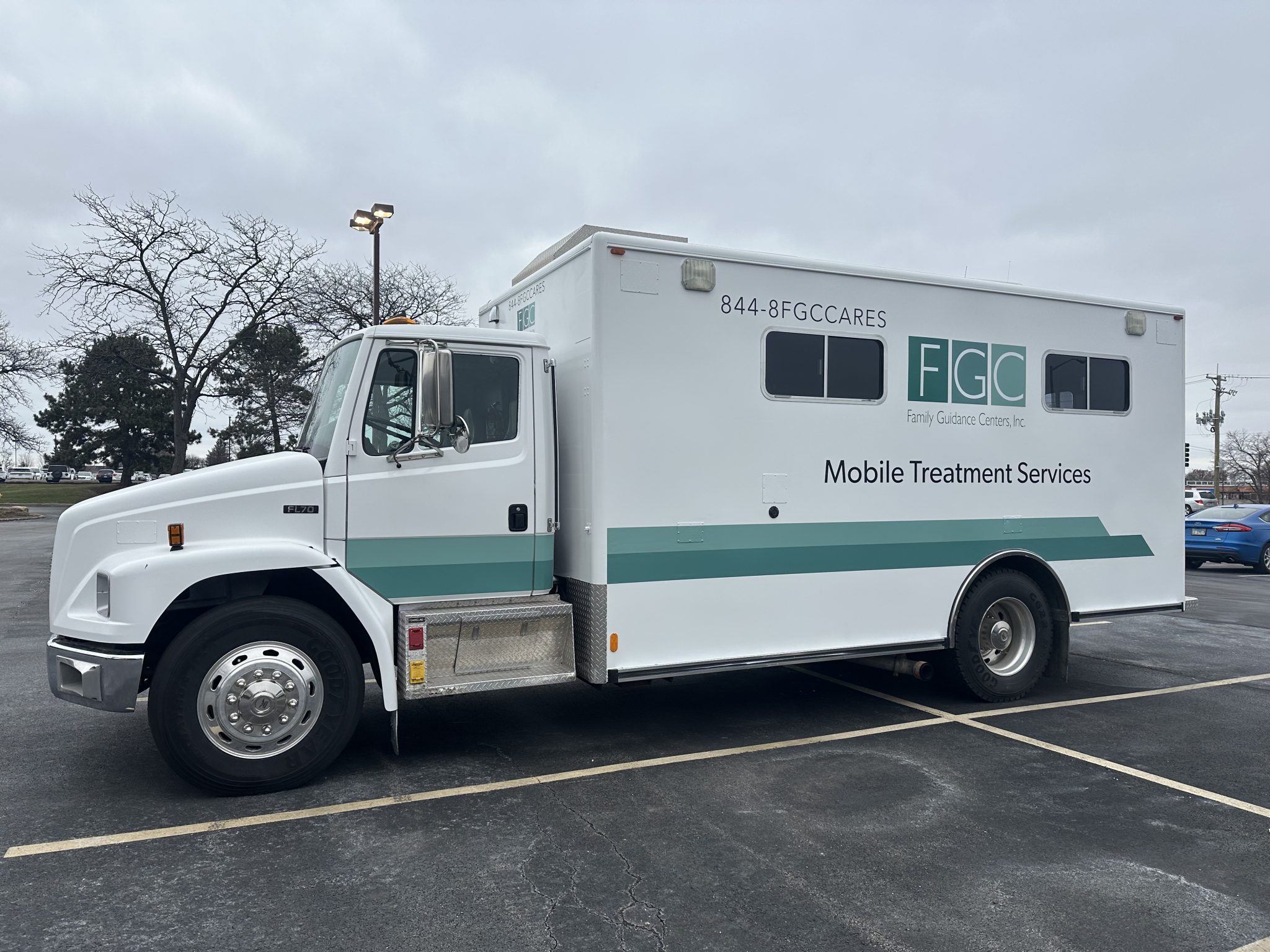 Full truck wrap for Family Guidance Centers featuring the logo and “Mobile Treatment Services” in green and white design.