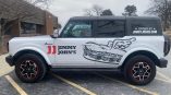 Partial vehicle wrap on a white Ford Bronco for Jimmy John's featuring red accents and sandwich graphics.