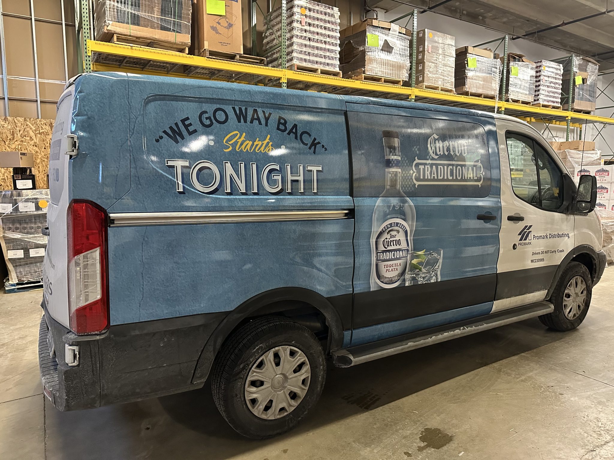 Partial van wrap for Promark Distributing featuring José Cuervo Tradicional branding and promotional graphics.