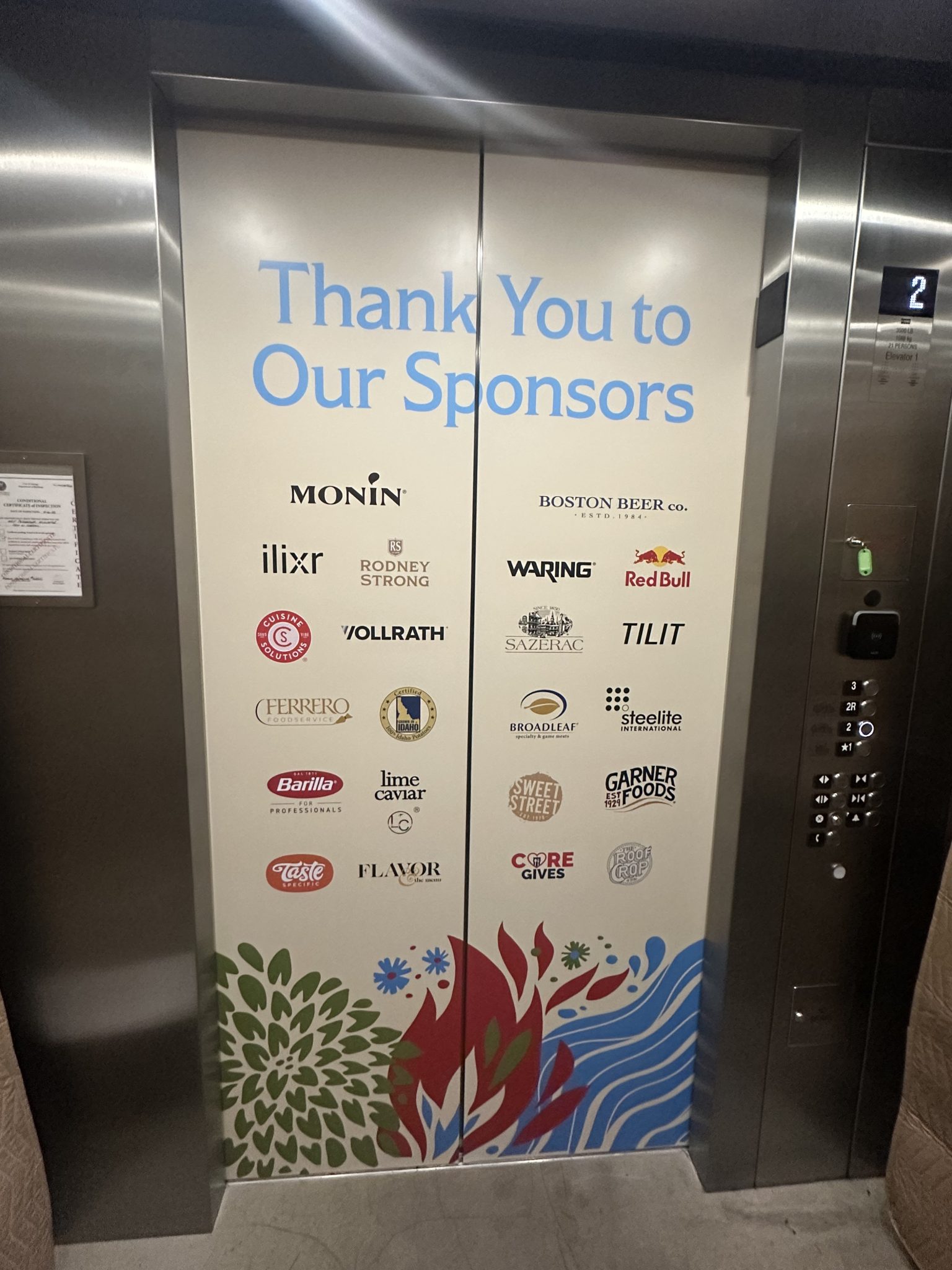 Elevator door graphic with colorful floral design, featuring sponsor logos and 'Thank You to Our Sponsors' text.