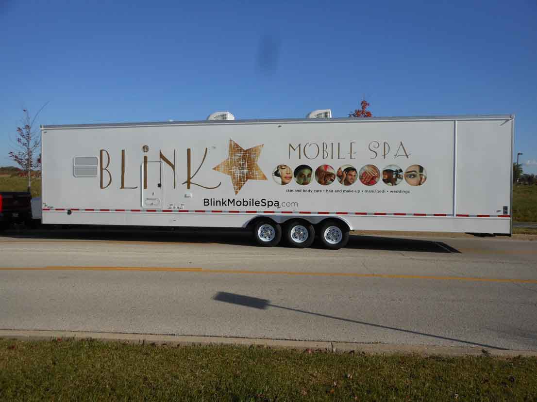 Van wrap for Blink Mobile Spa featuring a large logo and images of beauty services on a white background.