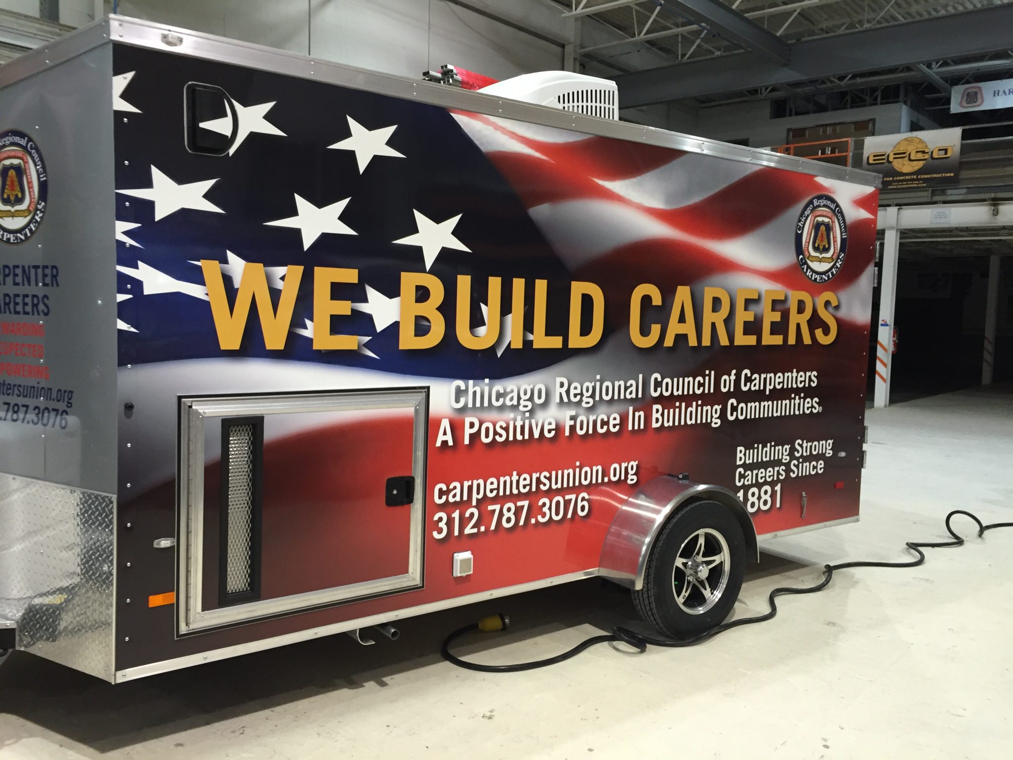 Full trailer wrap for the Chicago Regional Council of Carpenters with patriotic graphics and bold text.