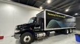 Full truck wrap for Darwill featuring graphic design with colorful dots and the tagline 'Marketing That Drives Results.'