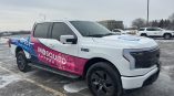 Full truck wrap for Mosquito Authority featuring a gradient design in blue, pink, and white colors.