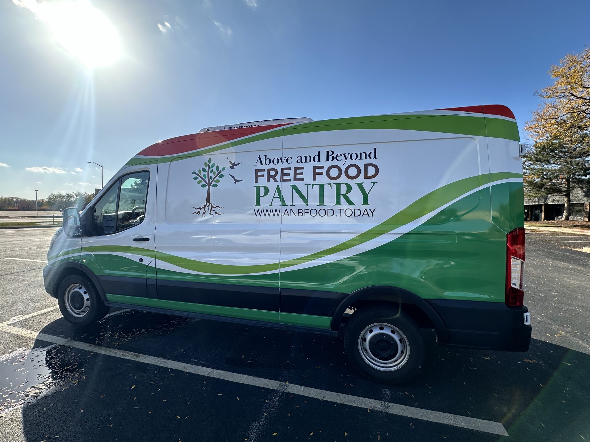 Commercial vehicle wrap on Ford Transit van for Naperville area business
