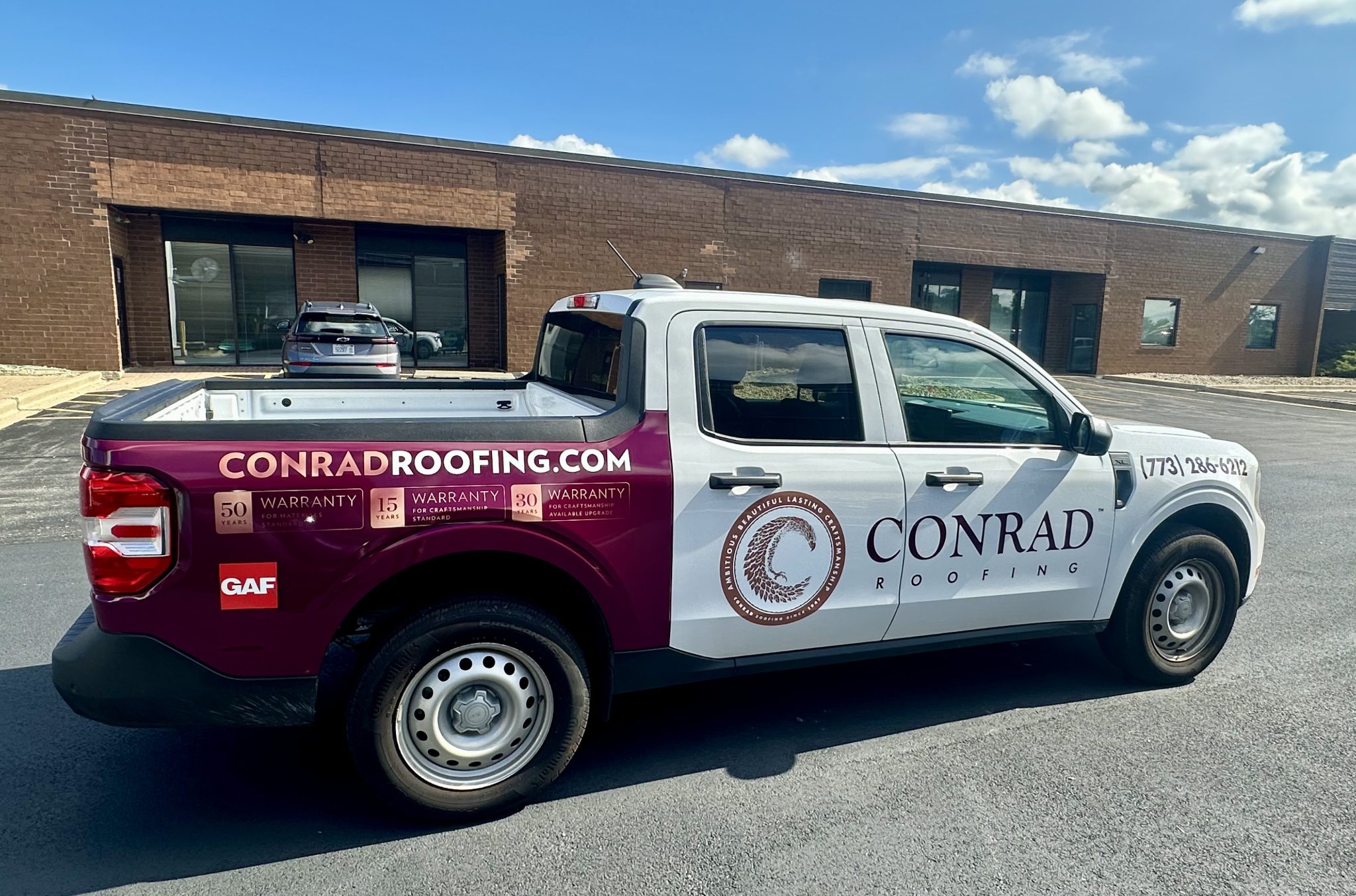 Professional vehicle wrap on Ford Maverick truck for Conrad Roofing Chicago area