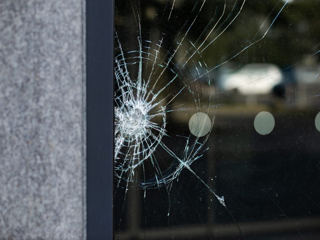 Broken security glass of a building exterior in Chicago