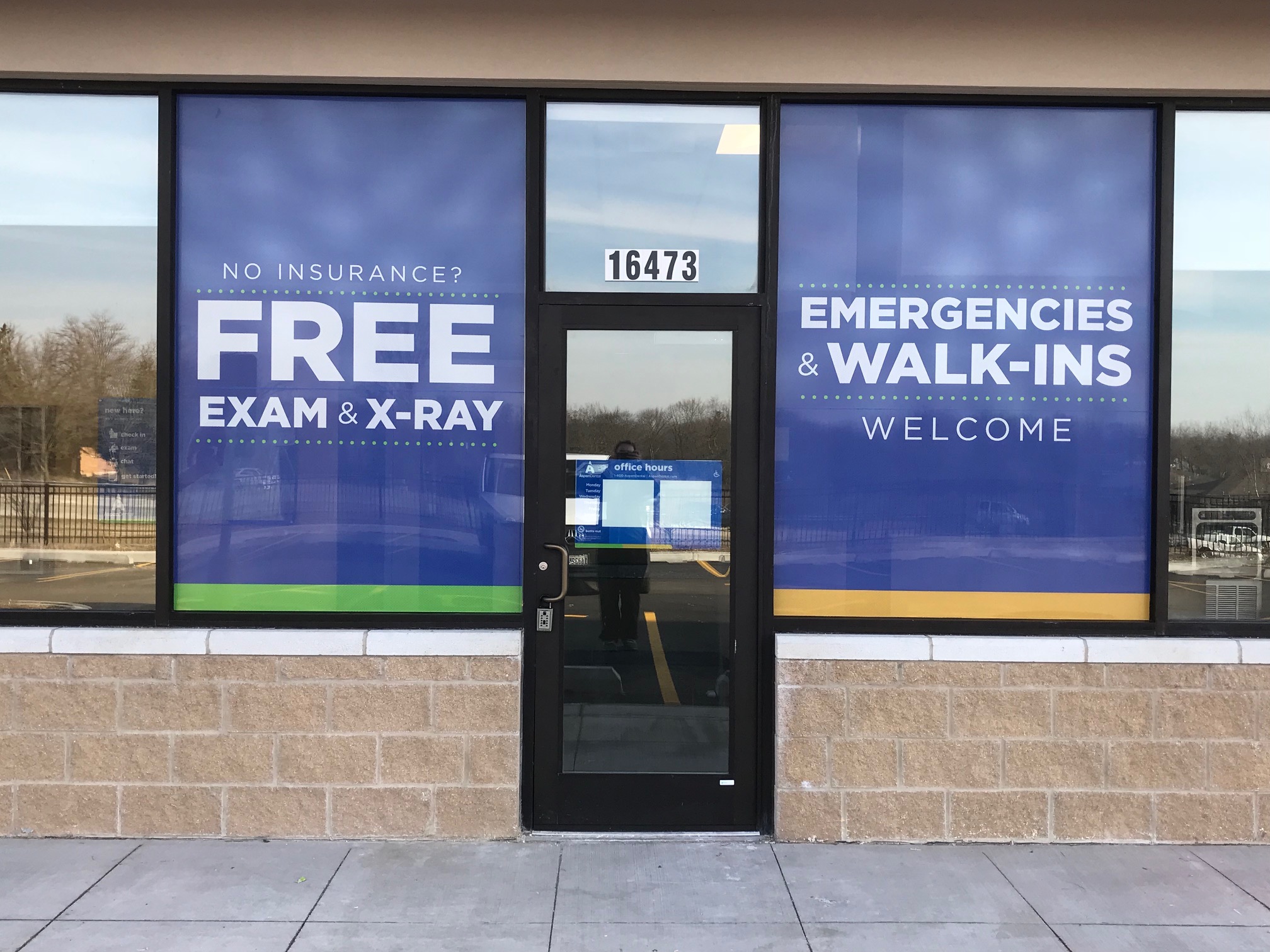 Security window film installation on commercial storefront Chicago