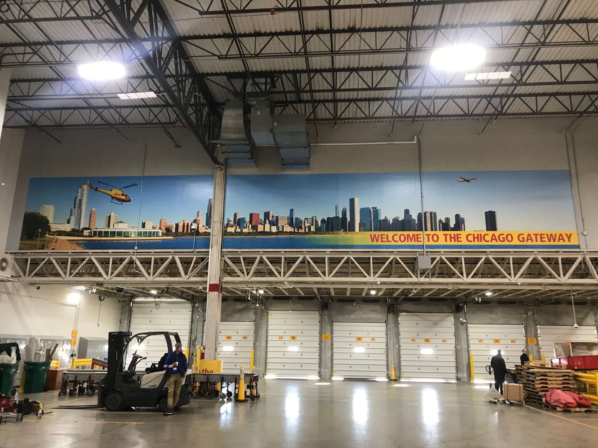 Floor-to-ceiling Chicago skyline wall mural installed in a corporate office lobby