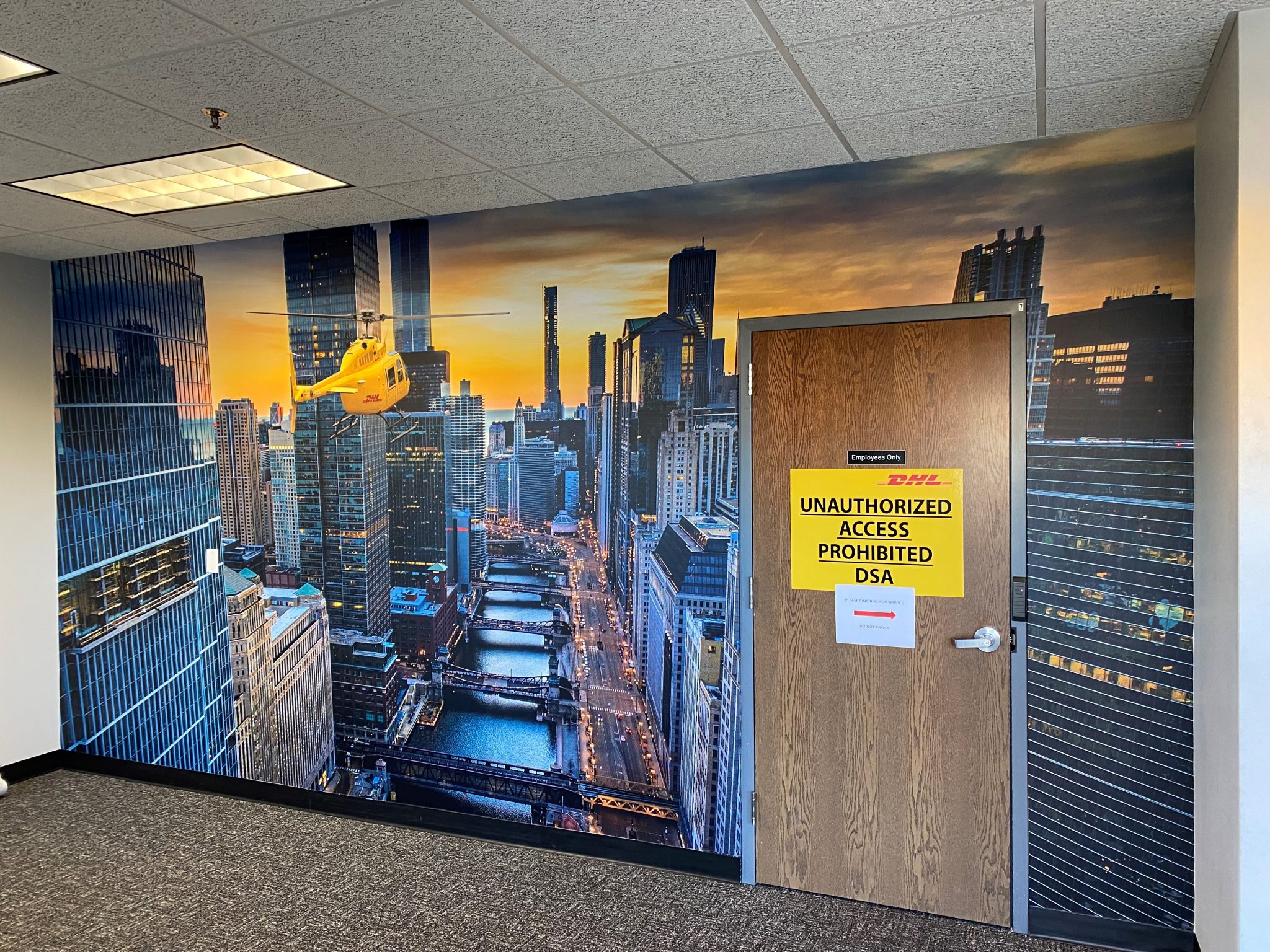 Wall mural installation in a Chicago corporate lobby by SpeedPro Windy City