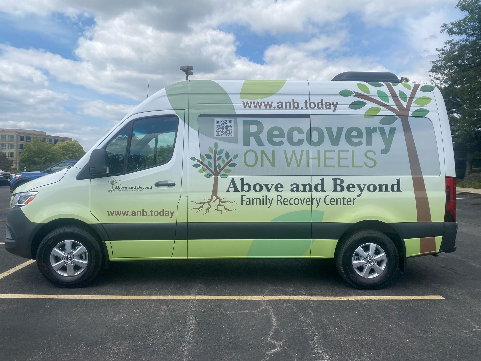 Full Sprinter van wrap with branded graphics for a family services organization, installed by SpeedPro Windy City in Downers Grove