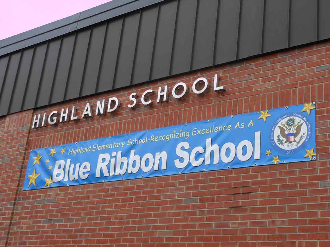 Highland Elementary School recognition banner displaying 'Blue Ribbon School' on a blue background with stars.