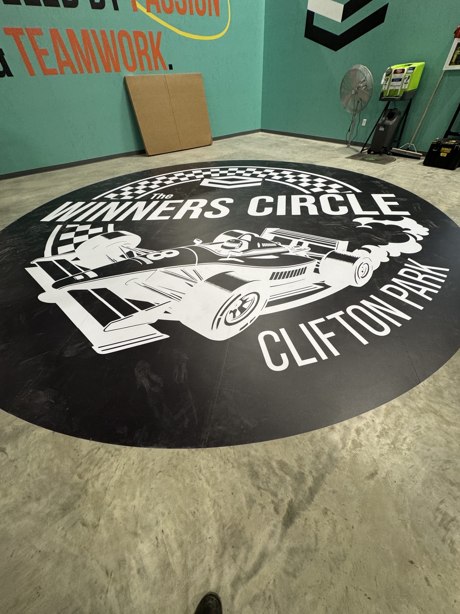 Large-format printed floor decal graphic in a warehouse facility, installed by SpeedPro Windy City