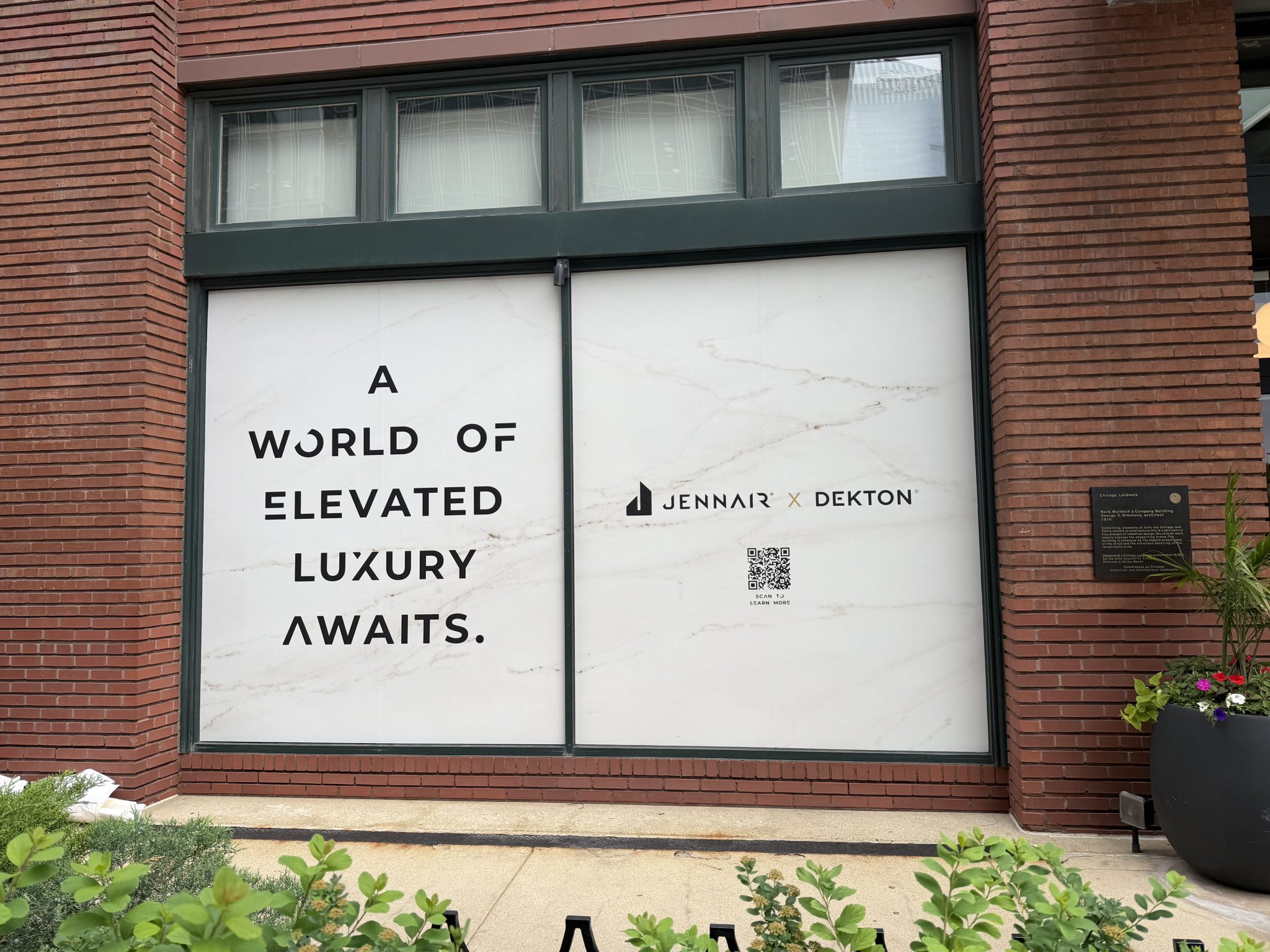 Marble-pattern window graphics for a luxury appliance brand activation on a landmark Chicago building, installed by SpeedPro Windy City