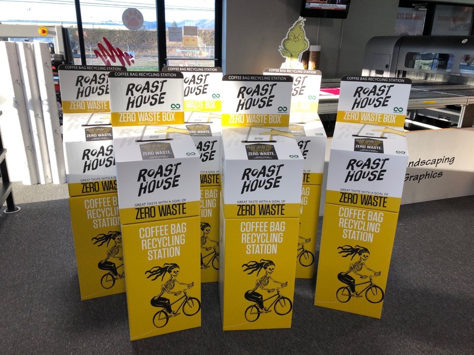 Advertising poster with group of boxes featuring text designs