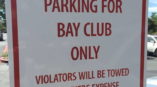 Signage for in front of parking space saying 