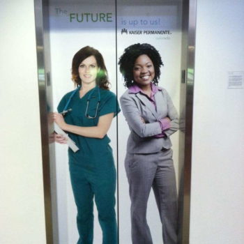 The Future is up to us Kaiser Permanente advertisement on an elevator wrap