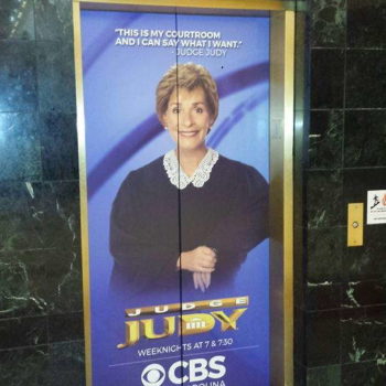 Judge Judy advertisement on an elevator wrap at the center court elevator