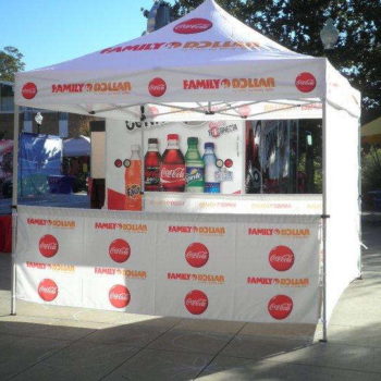 Family Dollar and Coca Cola event tent with different coke product bottles