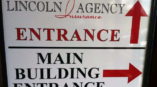 Lincoln Insurance Agency entrance and main building entrance signage
