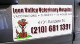 Leon Valley Veterinary Hospital logo on side of vehicle